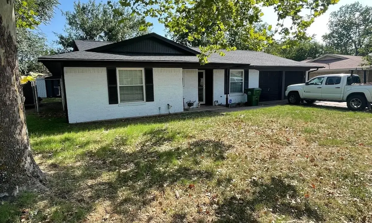 Professional roofing crew working on a residential roof in West Bradford